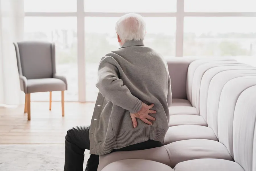 grandfather touching his back suffering from back 2022 02 04 00 40 40 utc